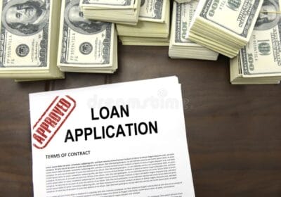 approved-loan-application-form-dollar-bills-28380035